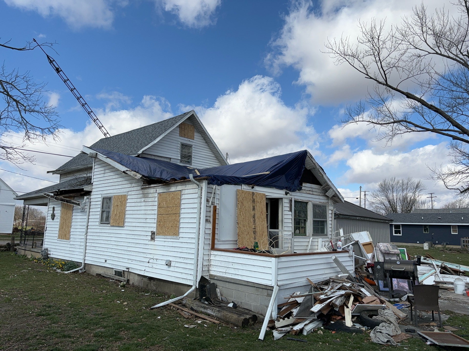 House with wind damage in Ohio before Swartz Restoration helped restore